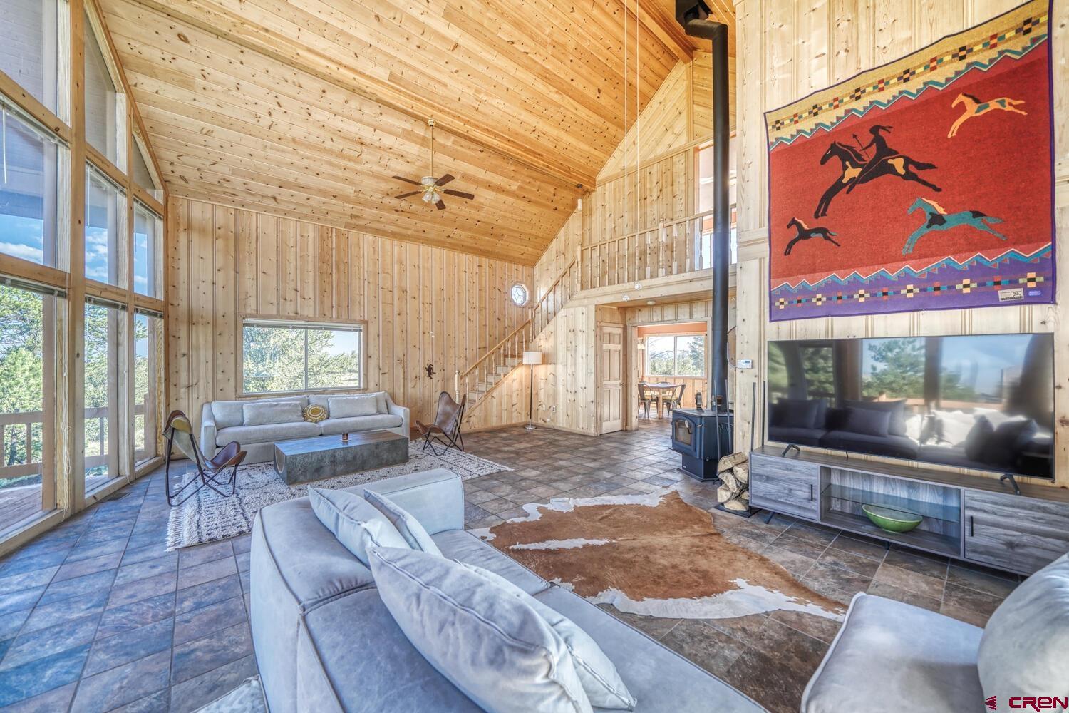 741 Wolfe Road Hartsel, CO 80449 - Photo 7 of 45 a living room with couch and a large window