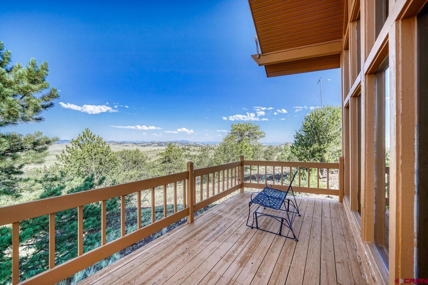741 Wolfe Road Hartsel, CO 80449 - Photo 9 of 45 a view of a balcony with wooden floor