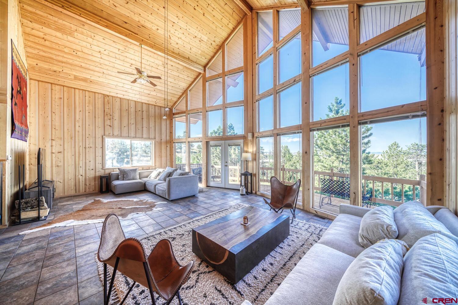 741 Wolfe Road Hartsel, CO 80449 - Photo 10 of 45 a bedroom with furniture and a large window
