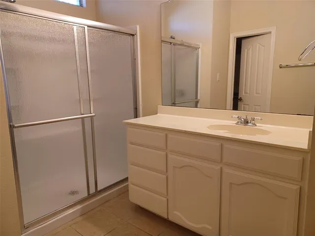 a bathroom with a sink and mirror