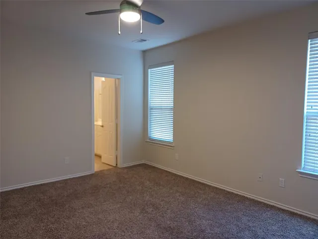 an empty room with a empty space and a window