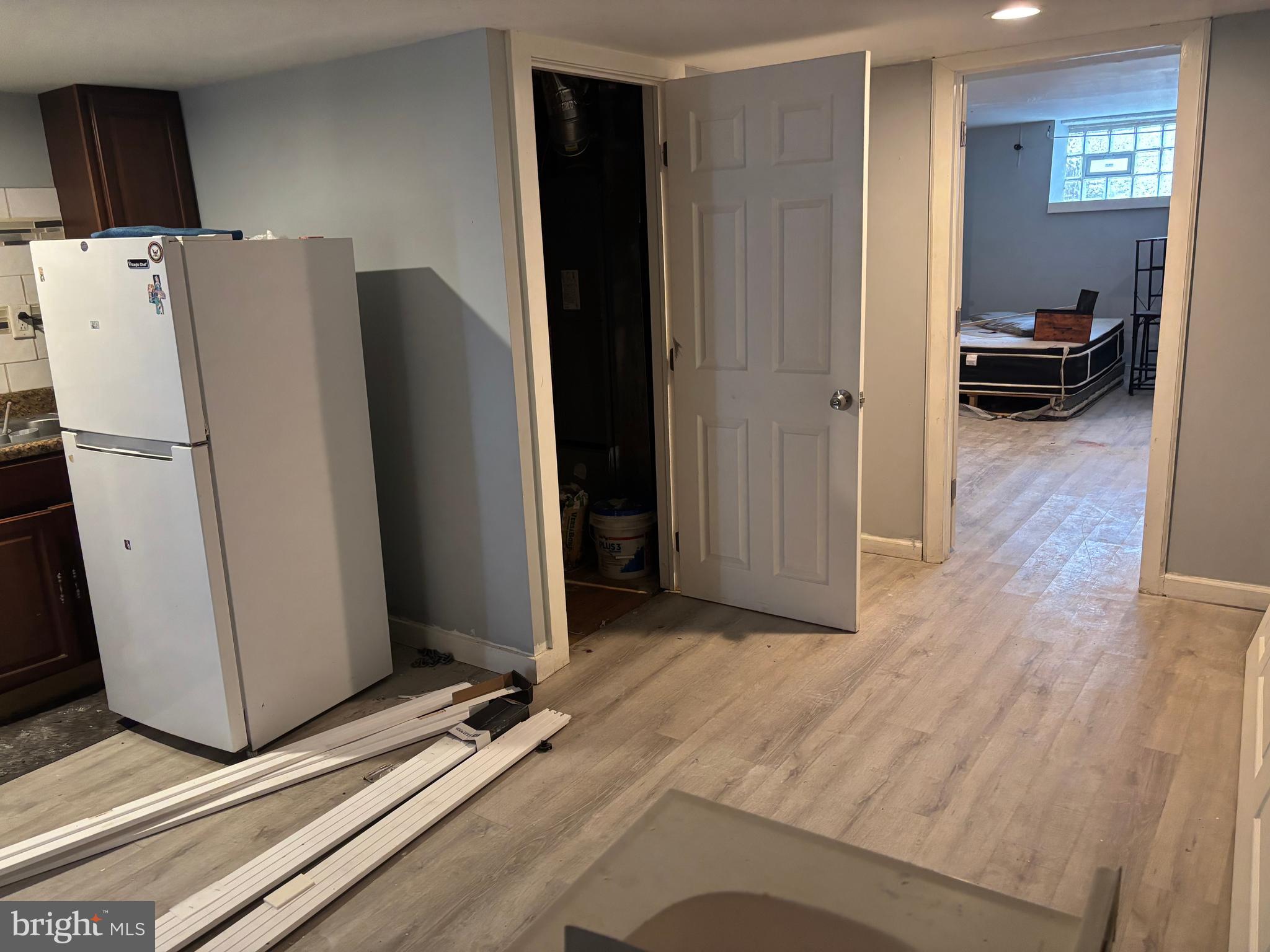1615 Mayland Street Philadelphia, PA 19138 - Photo 11 of 13 a view of a kitchen with refrigerator and wooden floor