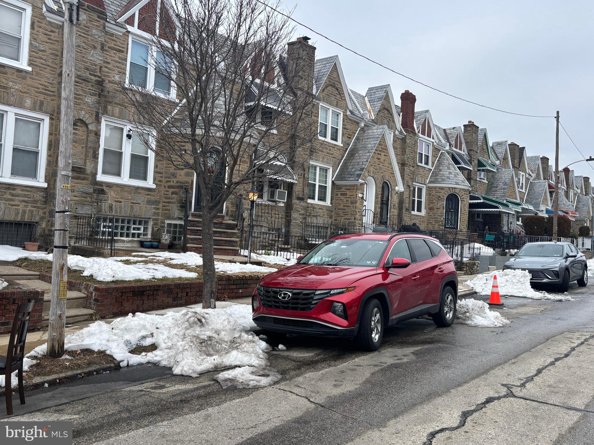 1615 Mayland Street Philadelphia, PA 19138 - Photo 12 of 13 a car parked in front of a brick building