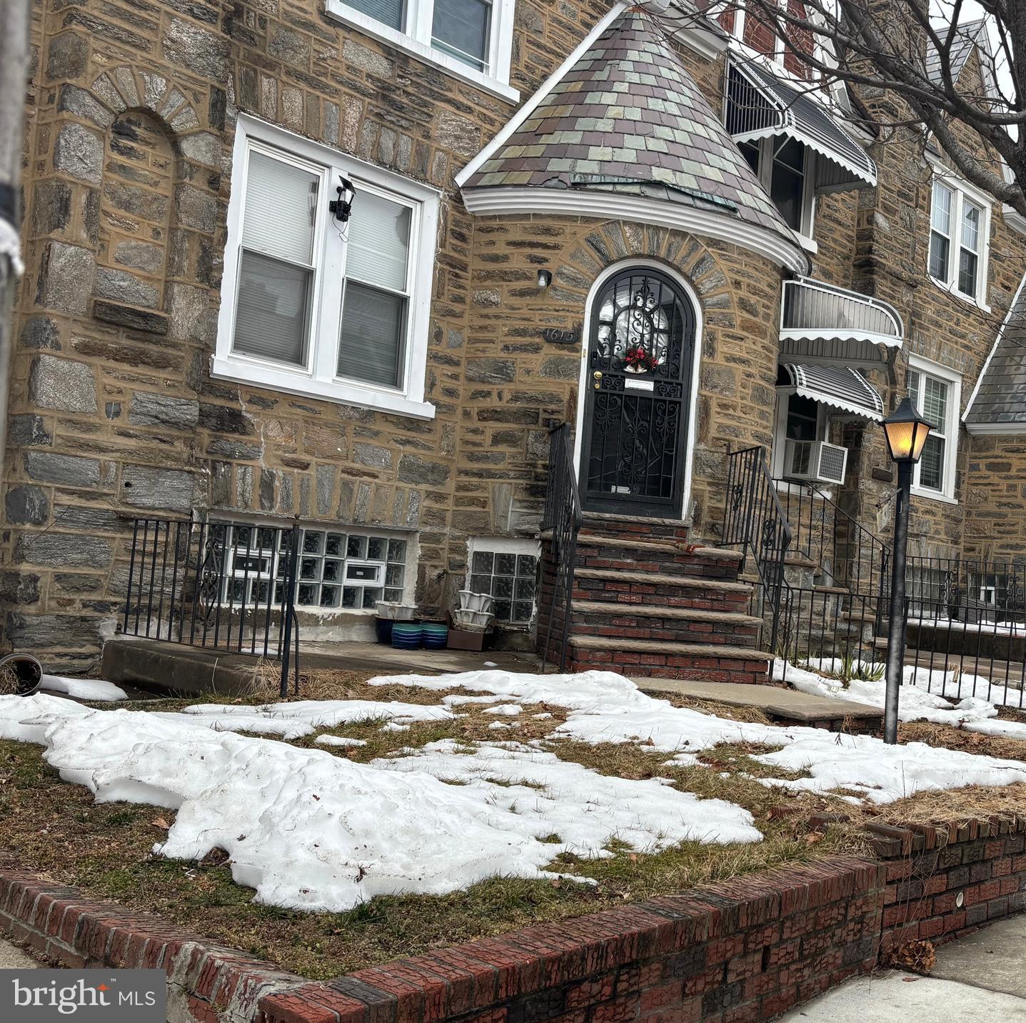 1615 Mayland Street Philadelphia, PA 19138 - Photo 3 of 13 a view of a brick house with large windows