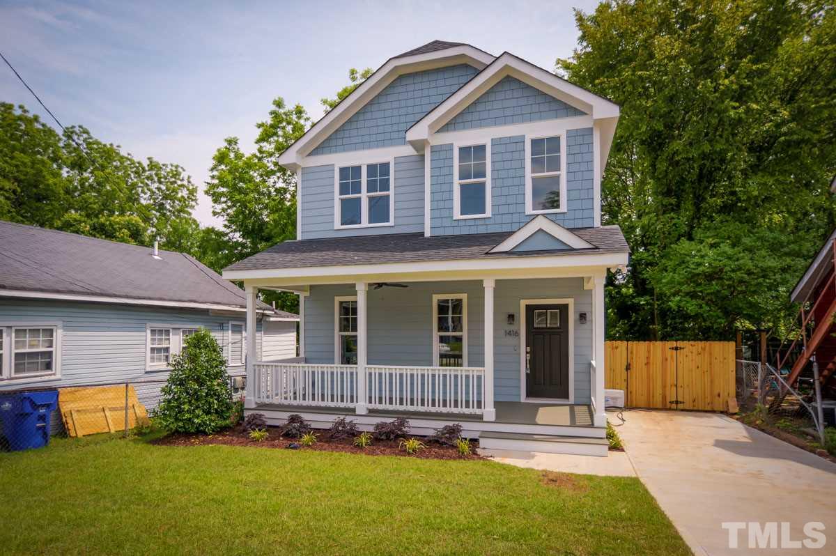 1416 East Jones Street Raleigh, NC 27610 - Photo 1 of 30 a view of a house with a yard plants and large tree