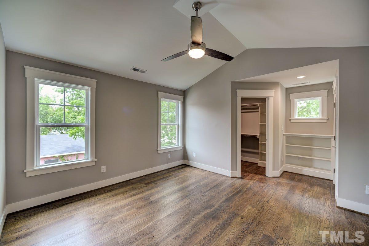 1416 East Jones Street Raleigh, NC 27610 - Photo 23 of 30 an empty room with wooden floor closet and windows