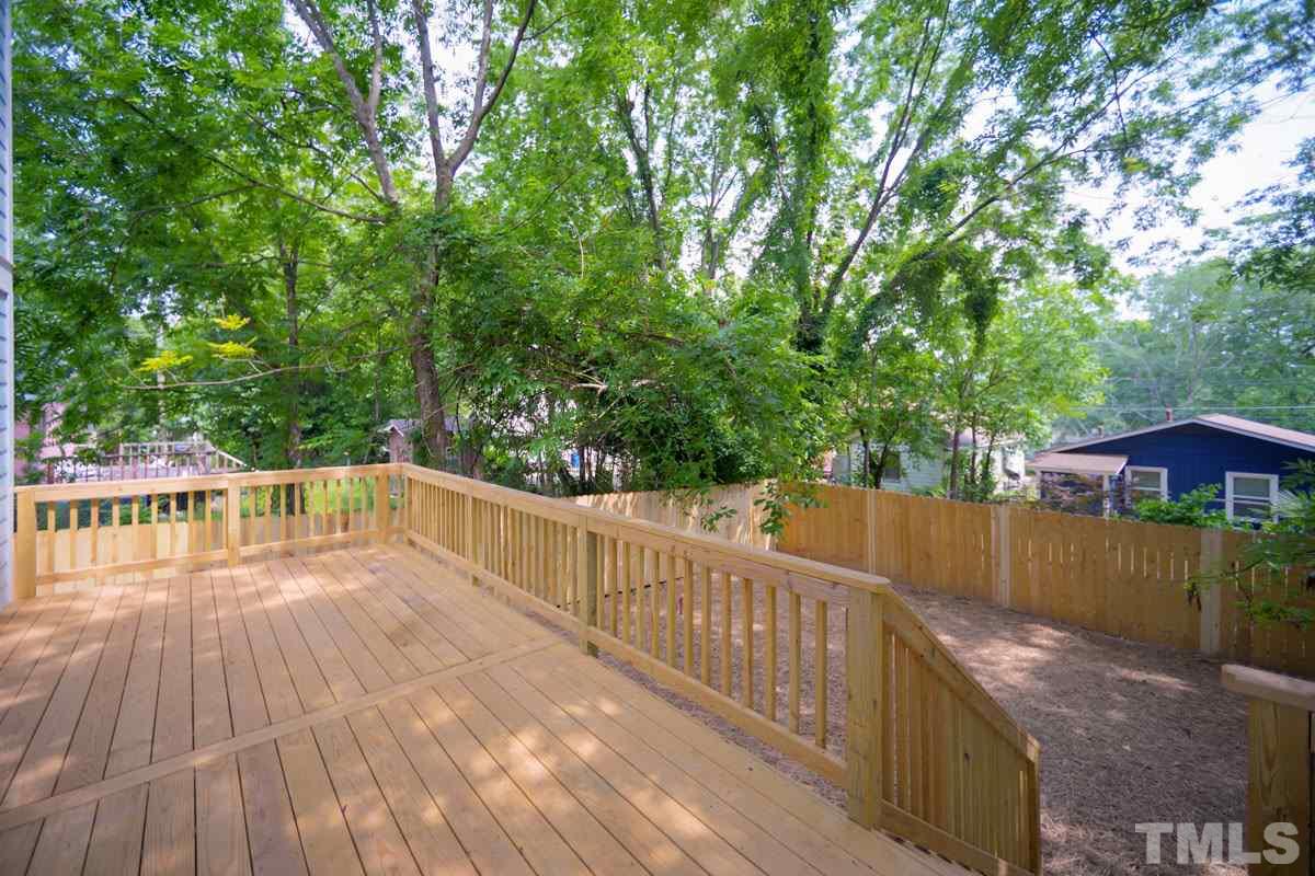 1416 East Jones Street Raleigh, NC 27610 - Photo 29 of 30 a view of deck with hardwood and trees