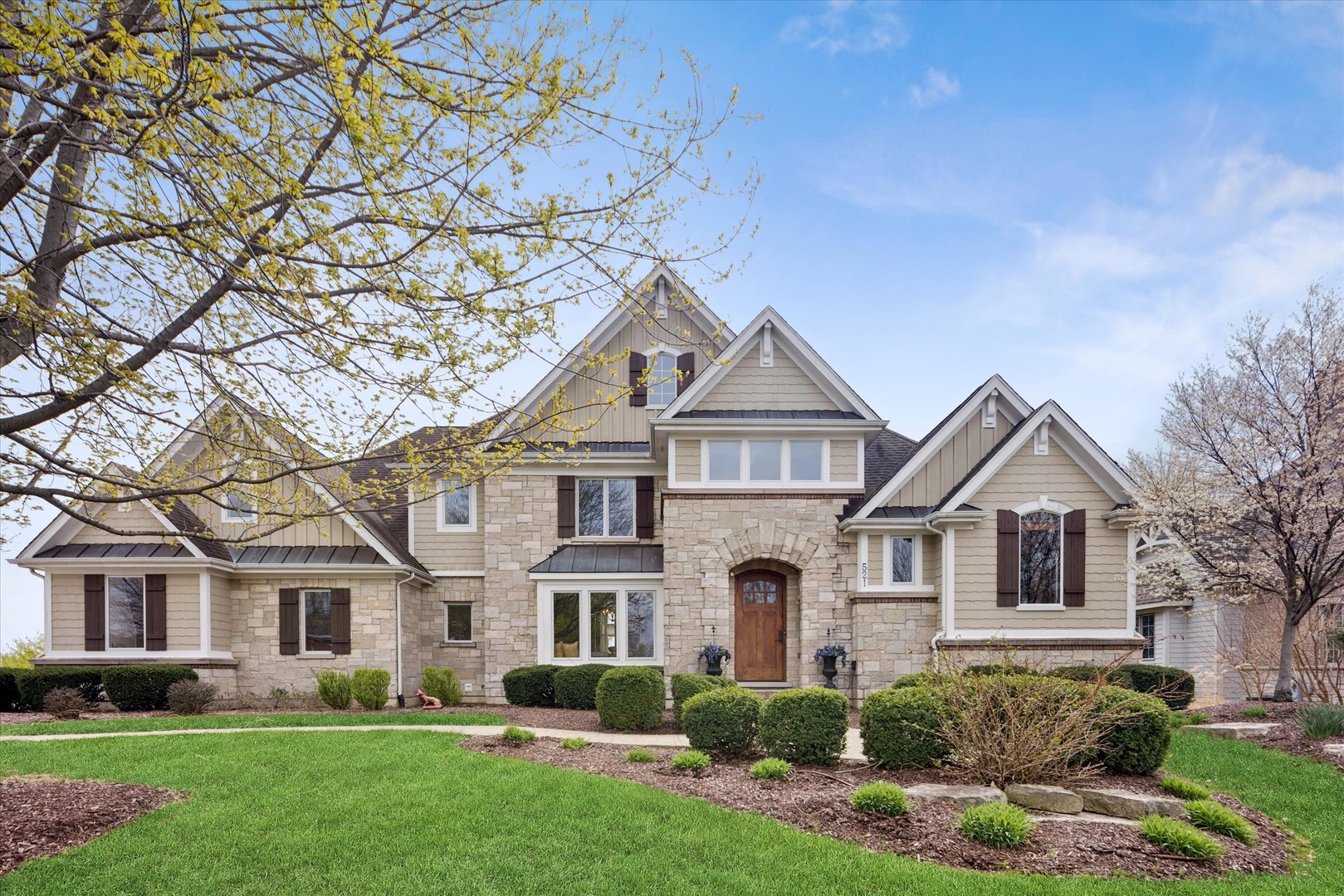 521 River Ridge Drive St. Charles, IL 60175 - Photo 1 of 46 a front view of a house with a yard and trees