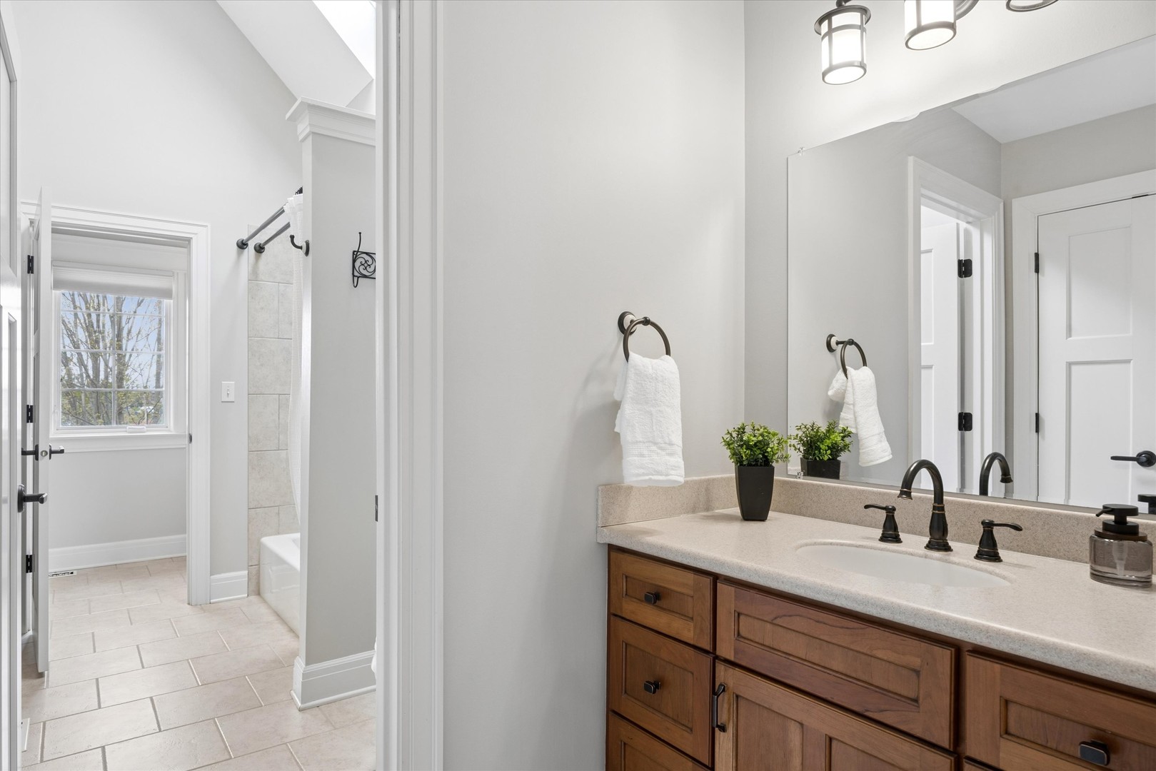 521 River Ridge Drive St. Charles, IL 60175 - Photo 24 of 46 a bathroom with a granite countertop sink and a mirror