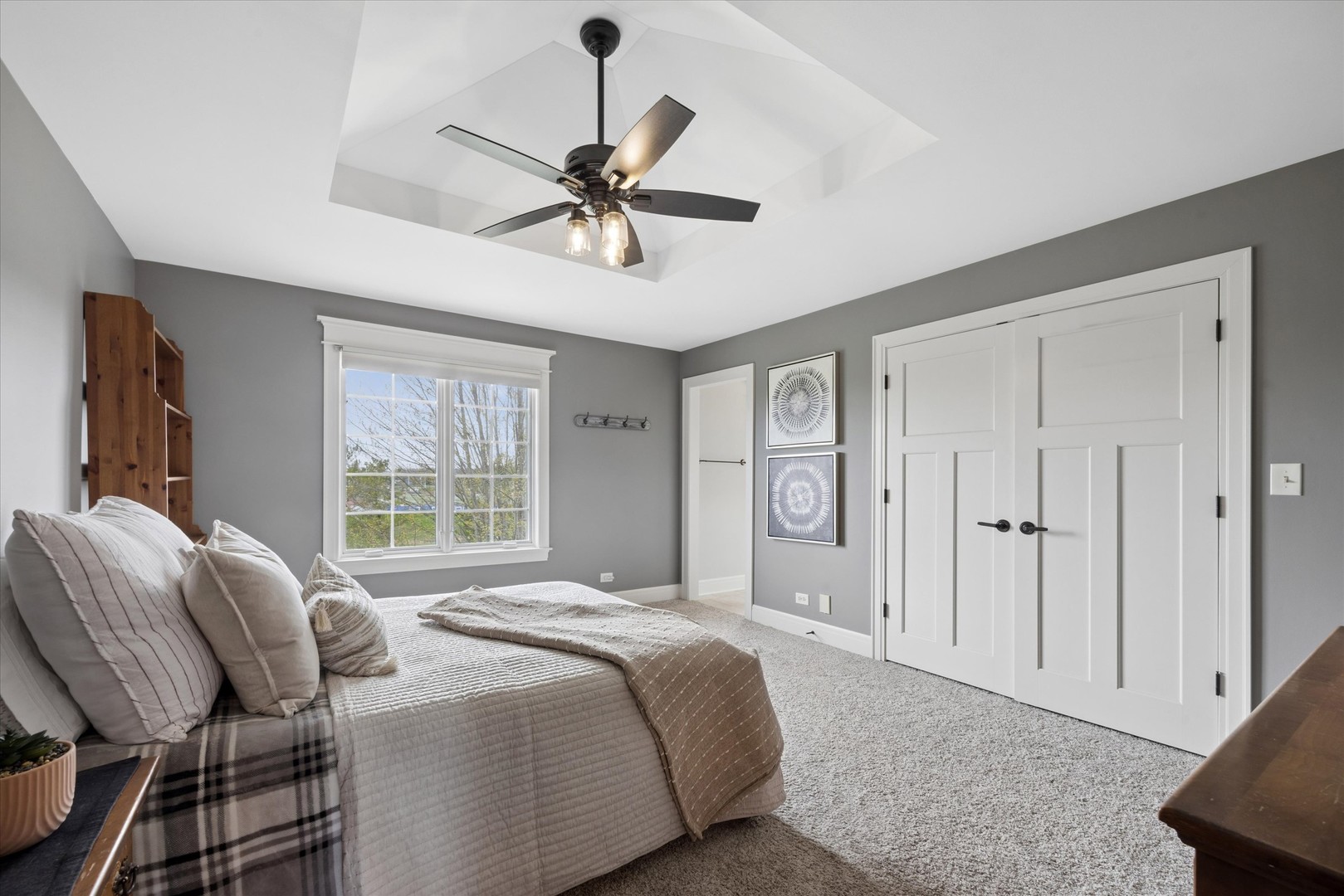 521 River Ridge Drive St. Charles, IL 60175 - Photo 25 of 46 a spacious bedroom with a bed a chandelier and large window