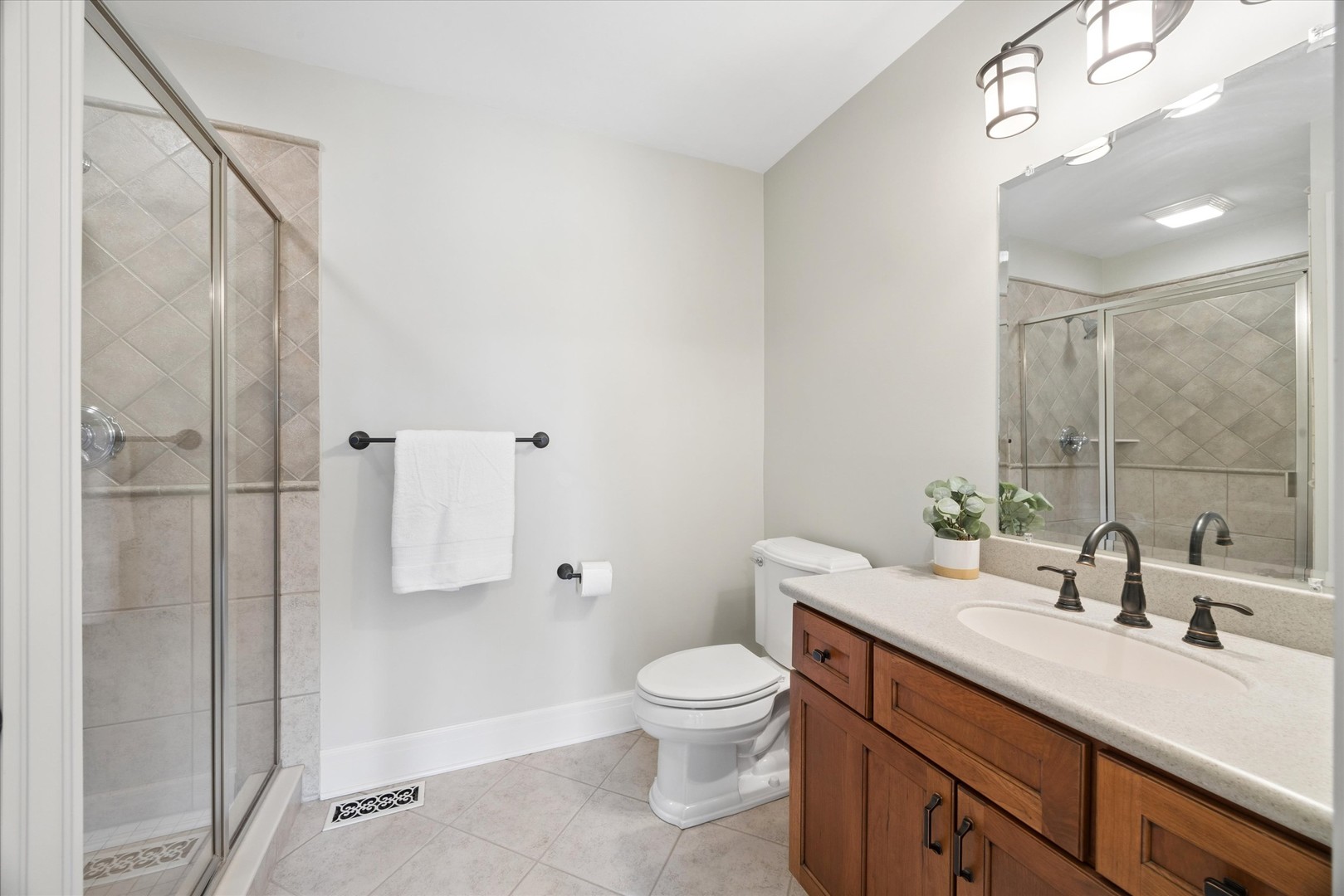 521 River Ridge Drive St. Charles, IL 60175 - Photo 28 of 46 a bathroom with a sink a toilet and shower