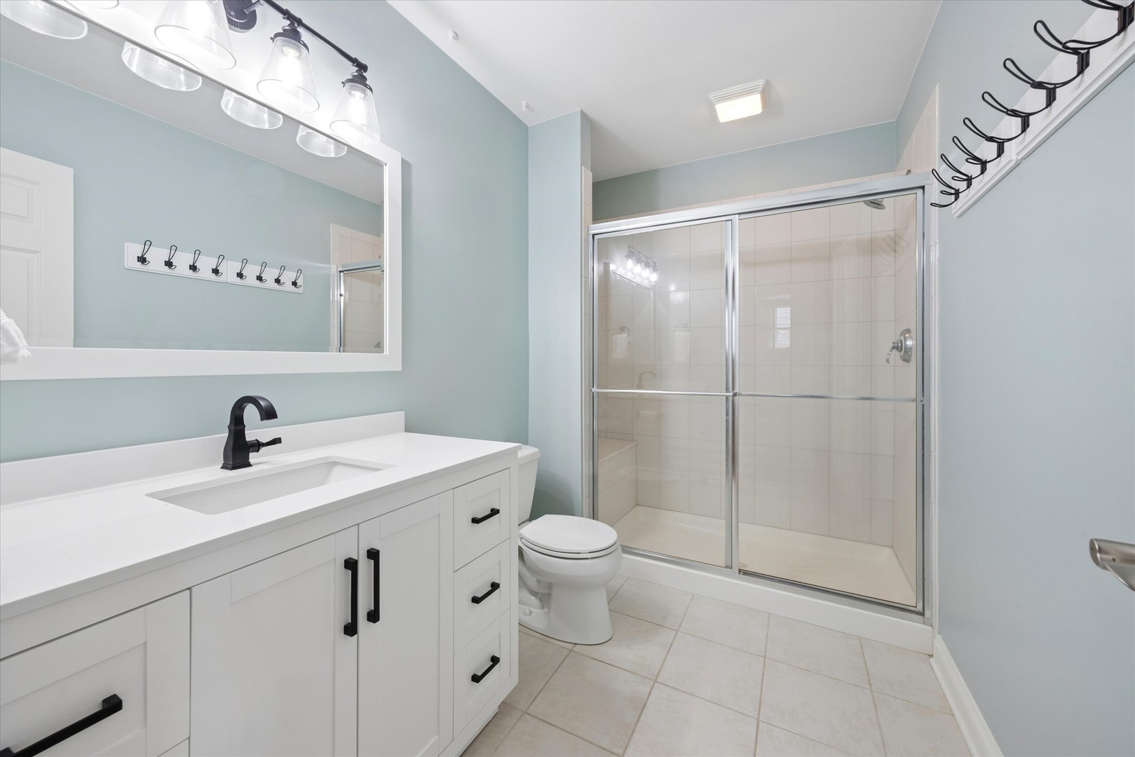 521 River Ridge Drive St. Charles, IL 60175 - Photo 33 of 46 a bathroom with a sink toilet vanity and shower