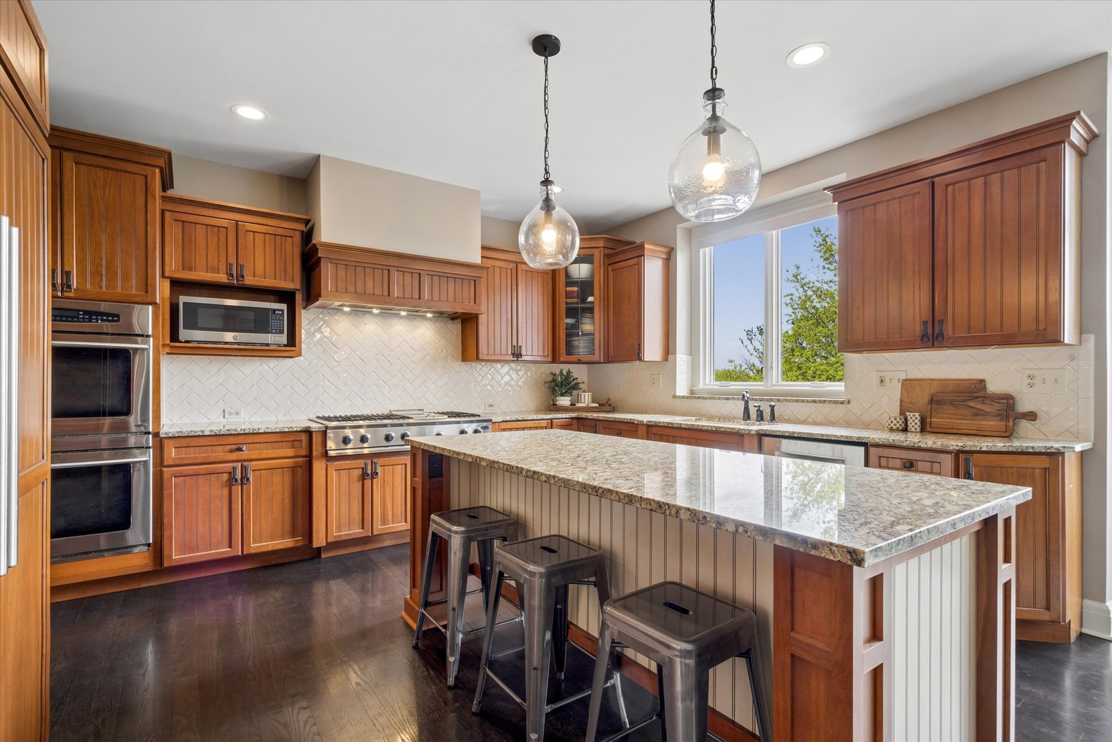 521 River Ridge Drive St. Charles, IL 60175 - Photo 6 of 46 a kitchen with granite countertop a sink a counter space appliances and cabinets