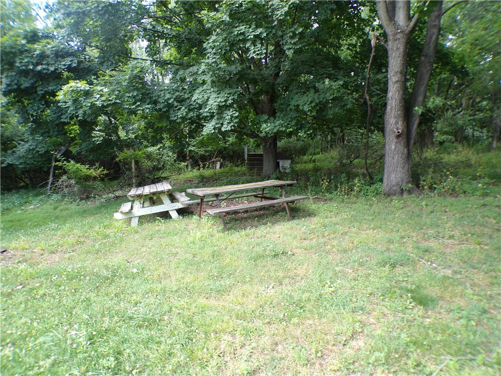 7877 Gun Club Road New Tripoli, PA 18066 - Photo 18 of 19 A verdant, tree-filled landscape offers a peaceful retreat with picnic tables.