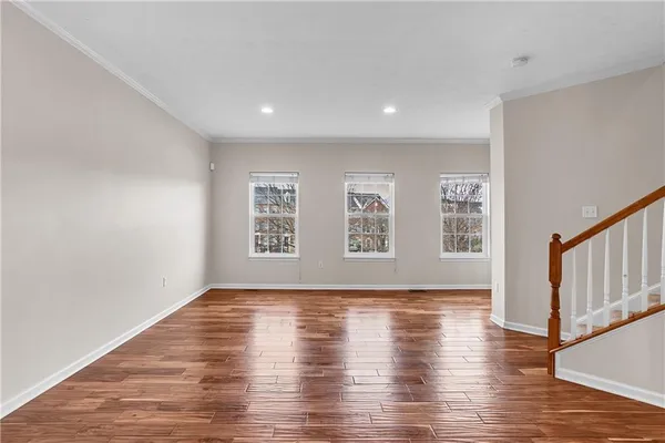 a view of room with wooden floor and window