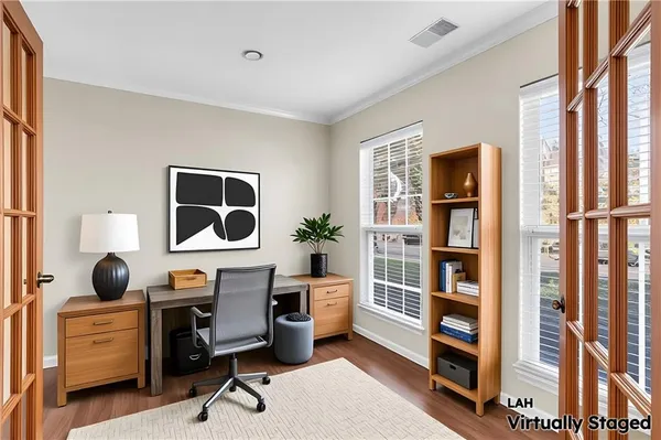 a workspace with furniture and window