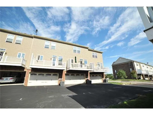 a view of open kitchen with a sink and cabinets