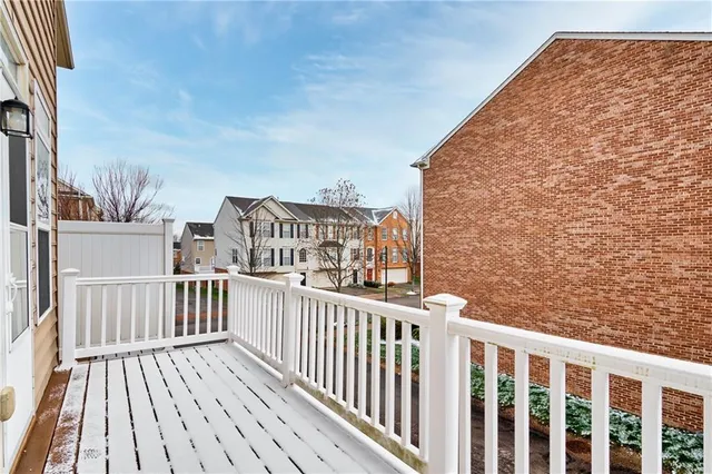 a view of a balcony with wooden floor