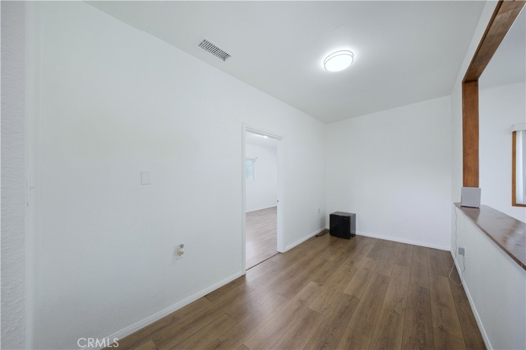1619 West 163rd Street Compton, CA 90220 - Photo 11 of 36 a view of empty room with wooden floor