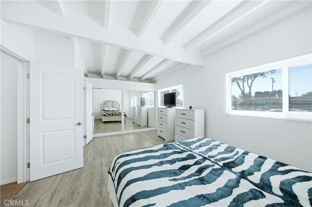 1619 West 163rd Street Compton, CA 90220 - Photo 13 of 36 a bedroom with a bed and a window