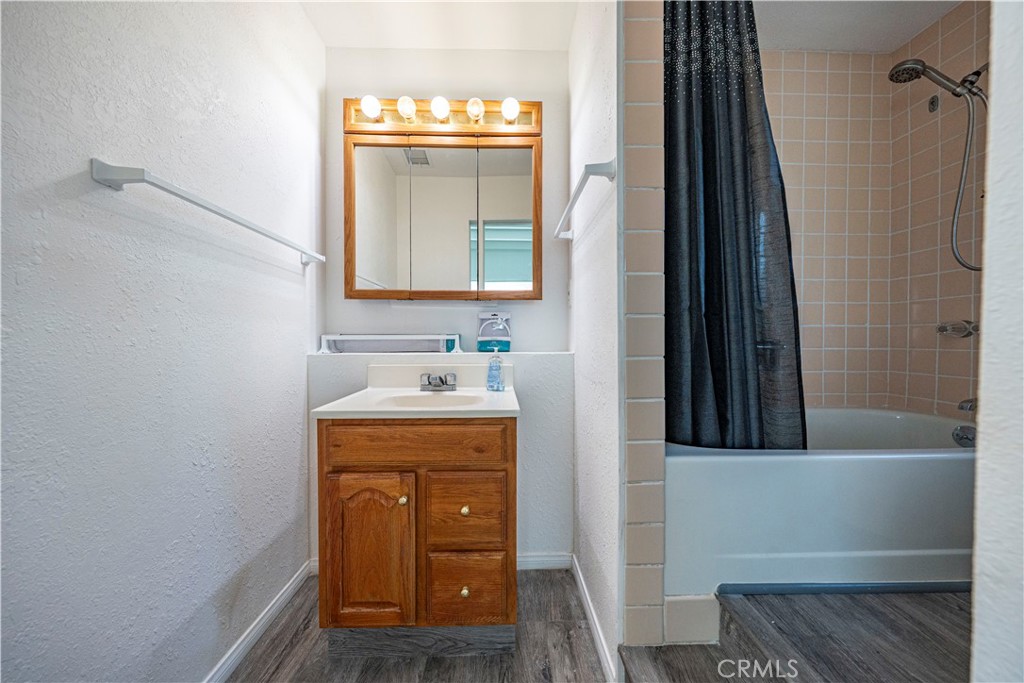 1619 West 163rd Street Compton, CA 90220 - Photo 14 of 36 a bathroom with a sink and a mirror