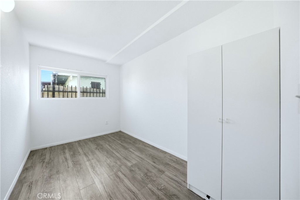 1619 West 163rd Street Compton, CA 90220 - Photo 20 of 36 a view of a room with wooden floor and windows