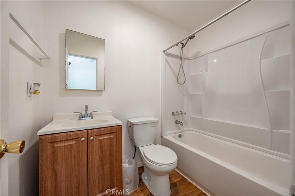 1619 West 163rd Street Compton, CA 90220 - Photo 22 of 36 a bathroom with a granite countertop toilet sink and shower