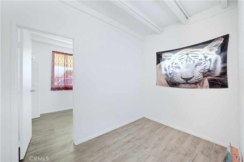 1619 West 163rd Street Compton, CA 90220 - Photo 23 of 36 an empty room with a painting on the wall