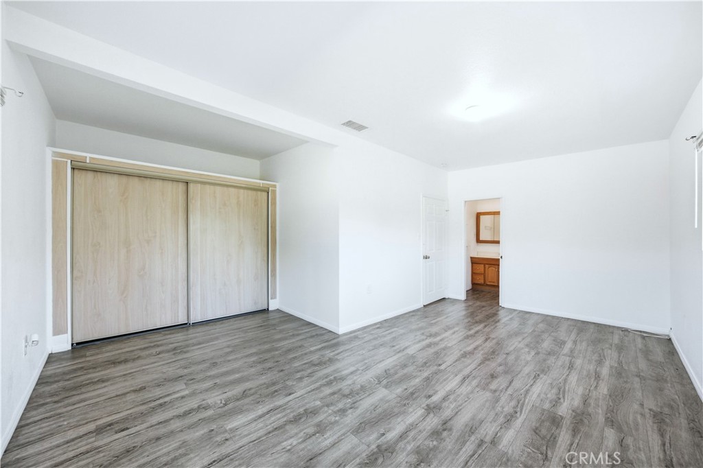 1619 West 163rd Street Compton, CA 90220 - Photo 26 of 36 an empty room with wooden floor
