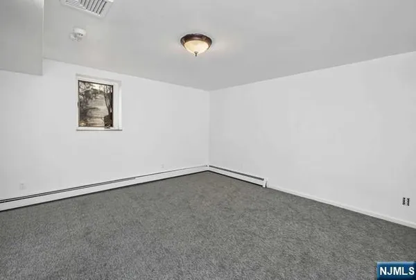 an empty room with a empty space and window