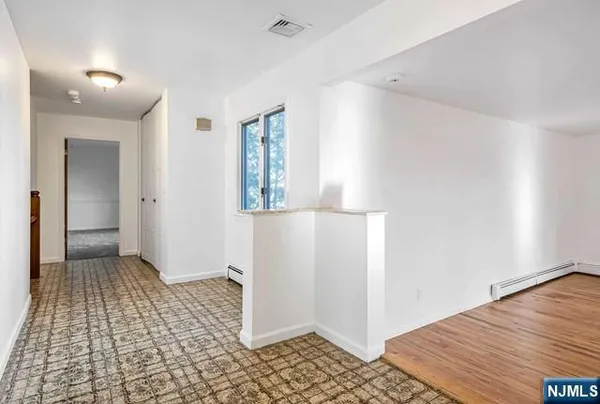 a view of an empty room and window