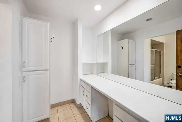 a room with a sink and cabinets