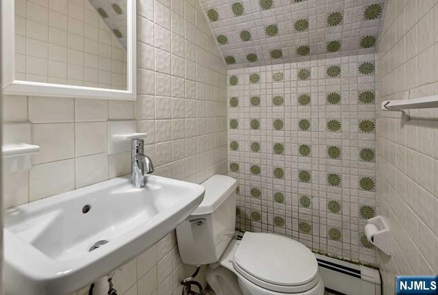 40 Ridge Road, Unit 1 Ridgewood, NJ 07450 - Photo 23 of 26 a bathroom with a sink toilet and shower