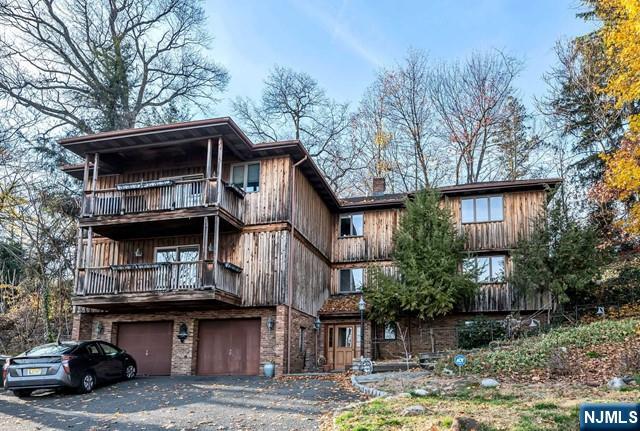40 Ridge Road, Unit 1 Ridgewood, NJ 07450 - Photo 25 of 26 a view of a house with a balcony