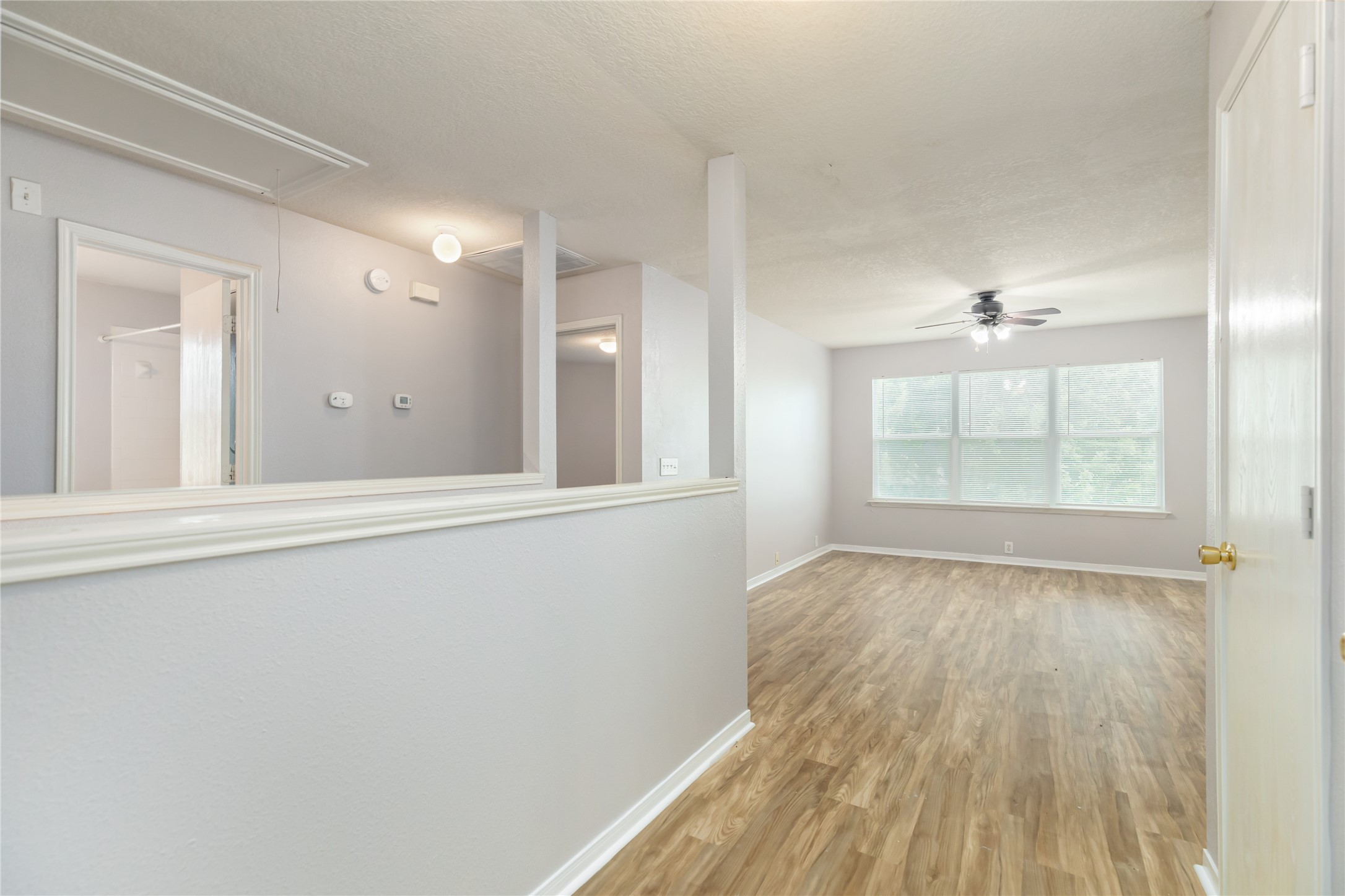 17334 Turquoise Stream Drive Houston, TX 77095 - Photo 24 of 31 wooden floor in an empty room with a window