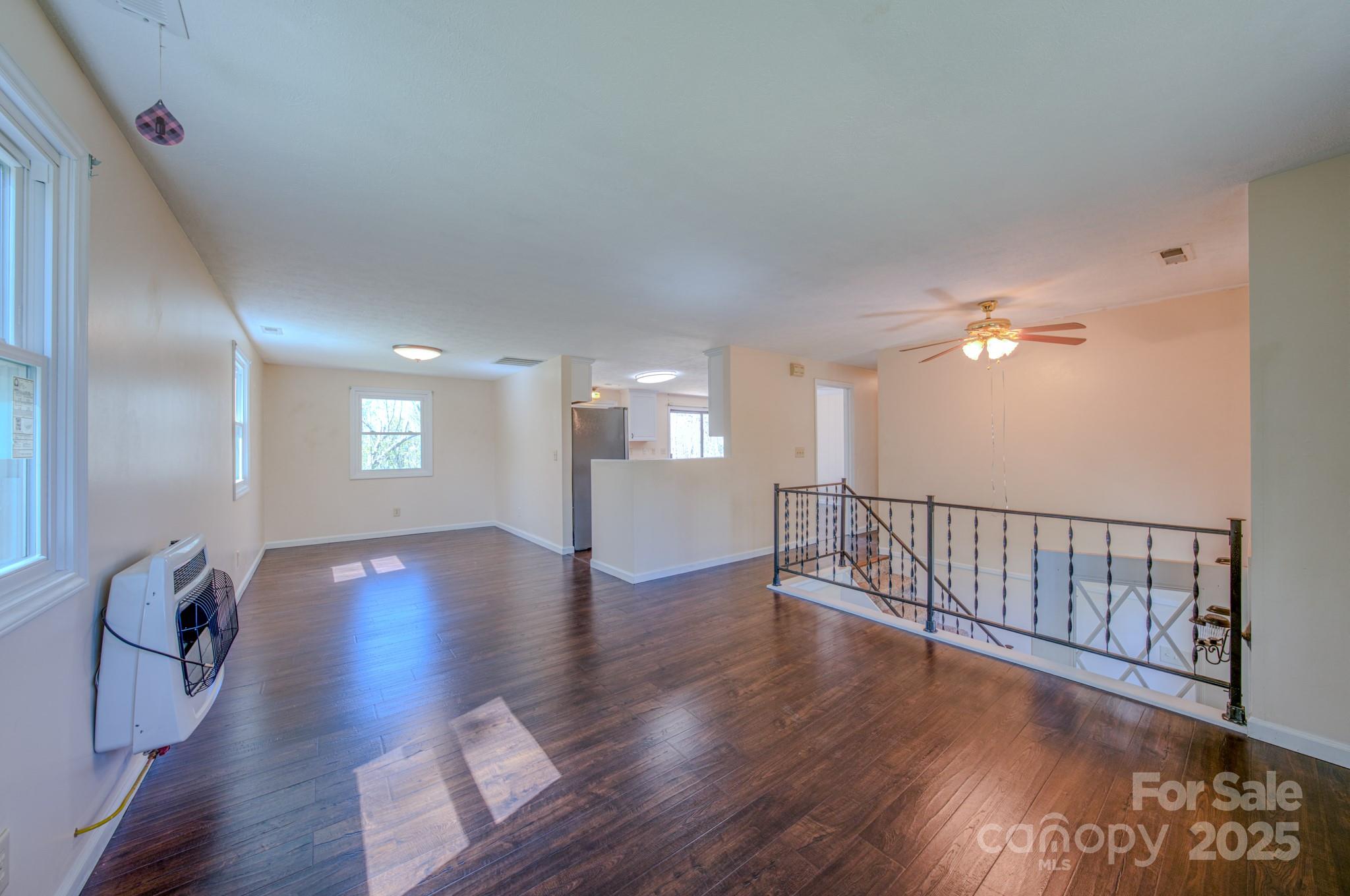 280 Fletcher View Drive Fletcher, NC 28732 - Photo 11 of 40 a view of an empty room with wooden floor and a window