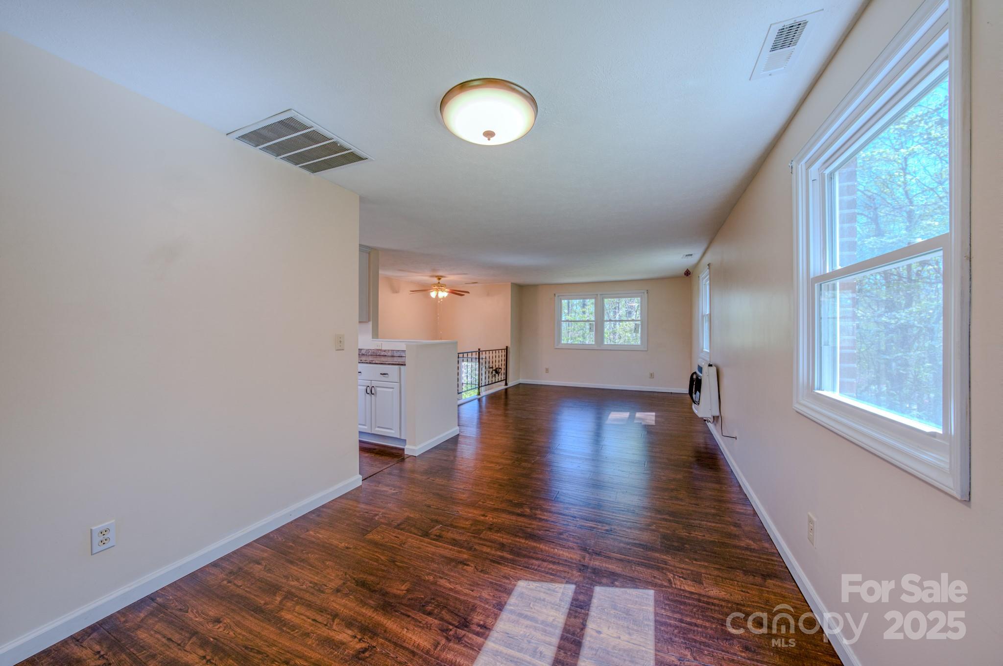 280 Fletcher View Drive Fletcher, NC 28732 - Photo 13 of 40 a view of empty room with wooden floor and fan