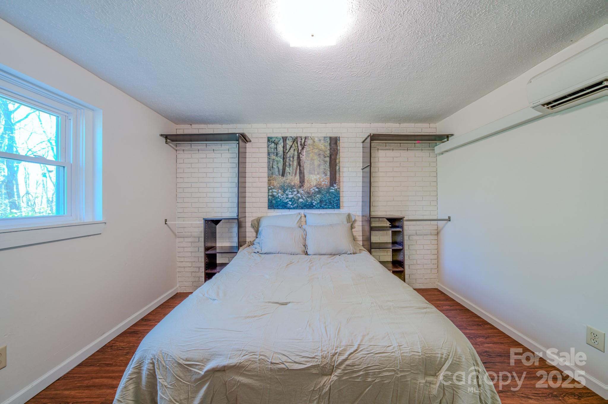 280 Fletcher View Drive Fletcher, NC 28732 - Photo 17 of 40 a bedroom with a bed and window