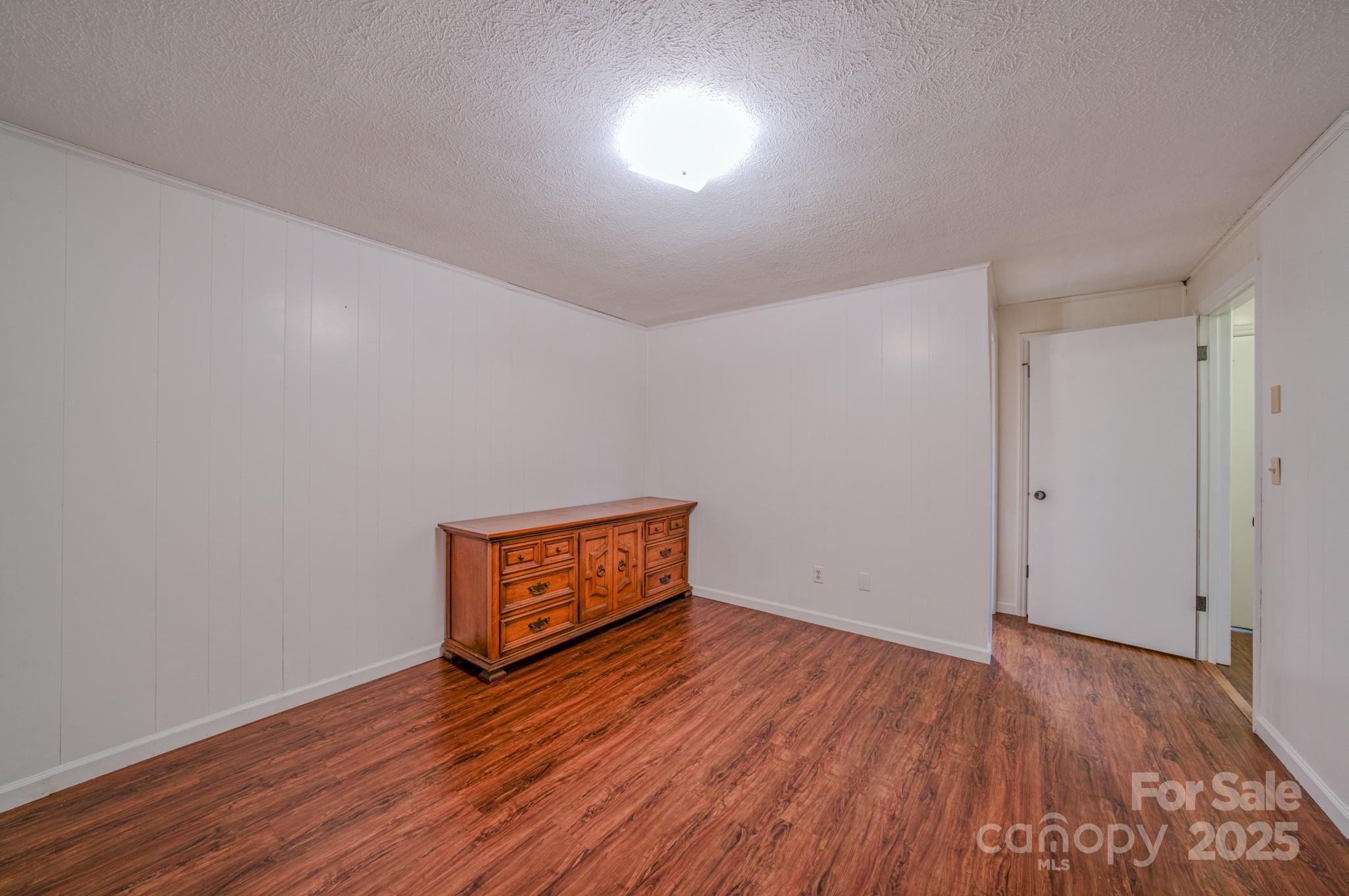 280 Fletcher View Drive Fletcher, NC 28732 - Photo 27 of 40 a view of empty room with wooden floor