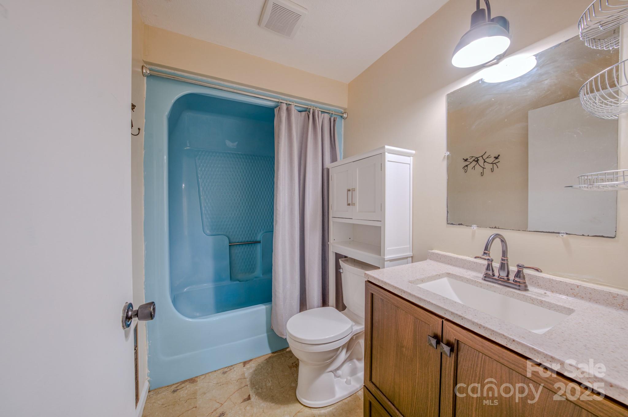 280 Fletcher View Drive Fletcher, NC 28732 - Photo 29 of 40 a bathroom with a sink a toilet and shower