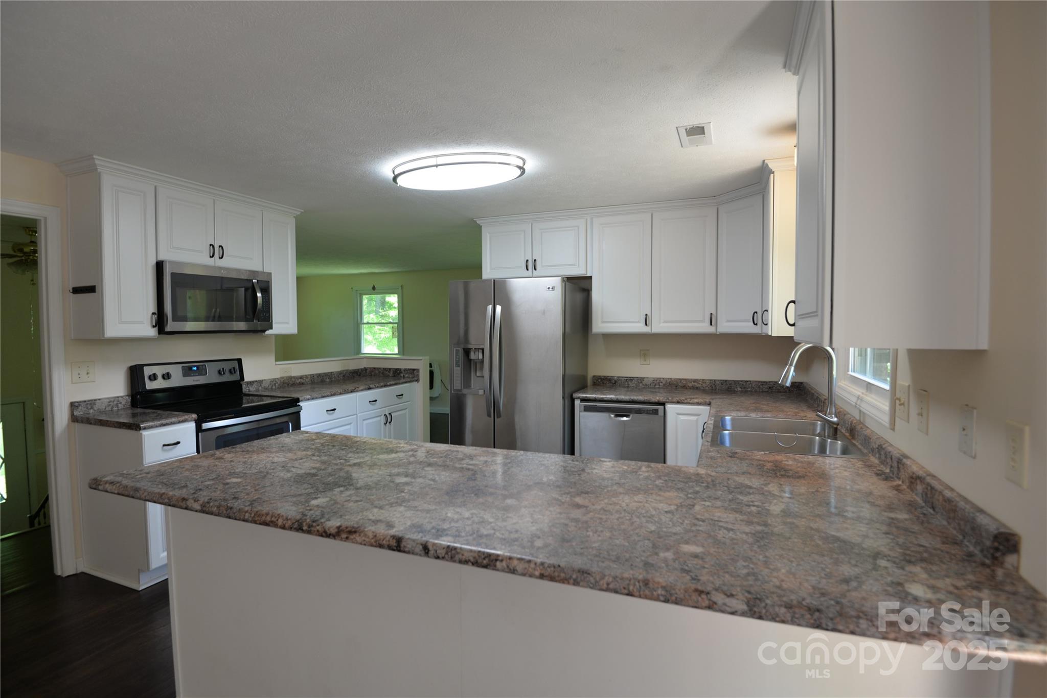 280 Fletcher View Drive Fletcher, NC 28732 - Photo 3 of 40 a kitchen with stainless steel appliances granite countertop a sink a stove and a granite counter top