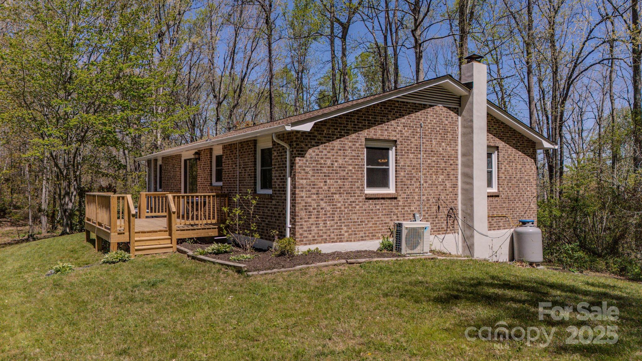 280 Fletcher View Drive Fletcher, NC 28732 - Photo 31 of 40 a view of a house with backyard and sitting area
