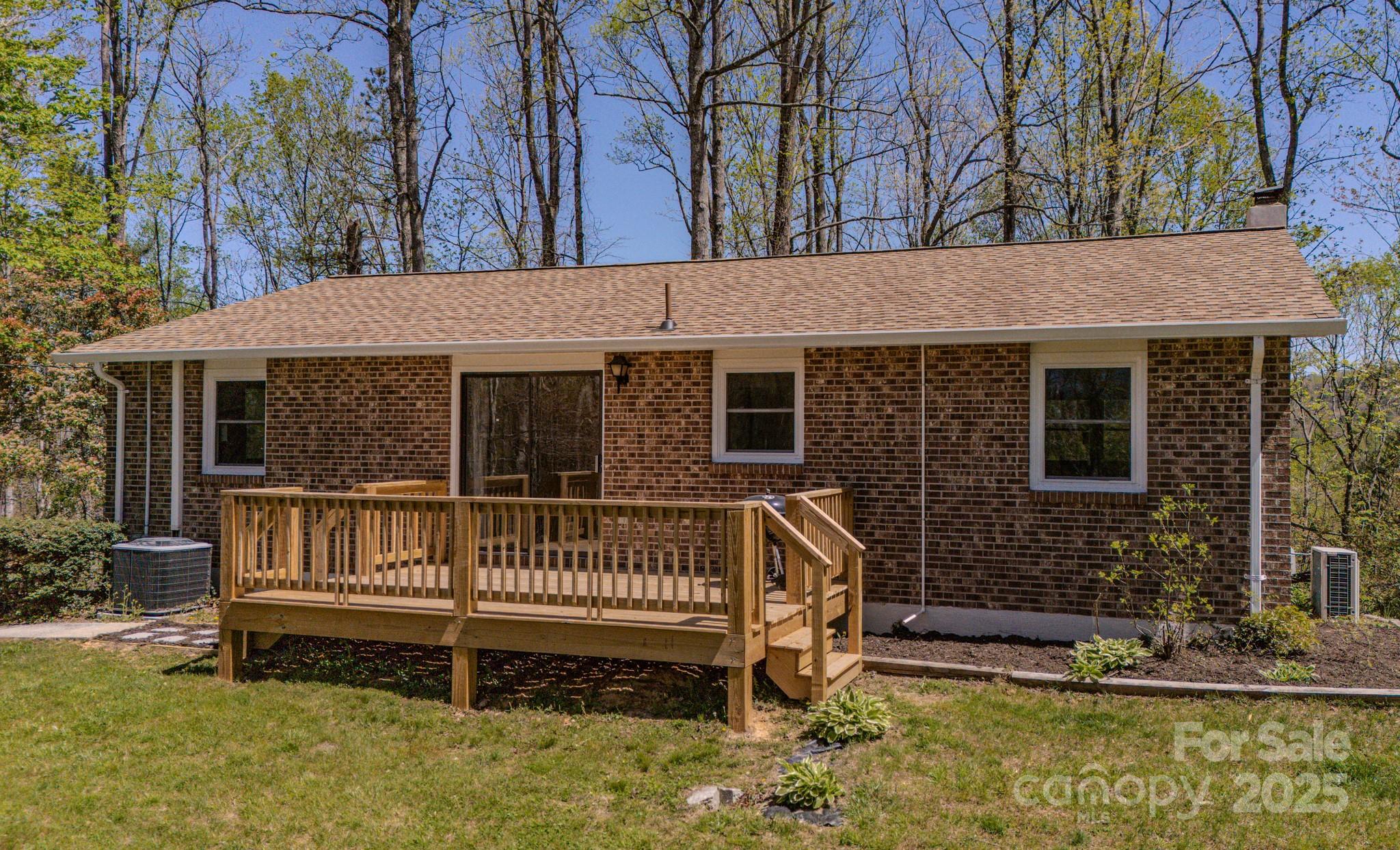 280 Fletcher View Drive Fletcher, NC 28732 - Photo 33 of 40 a front view of a house with a yard deck and furniture