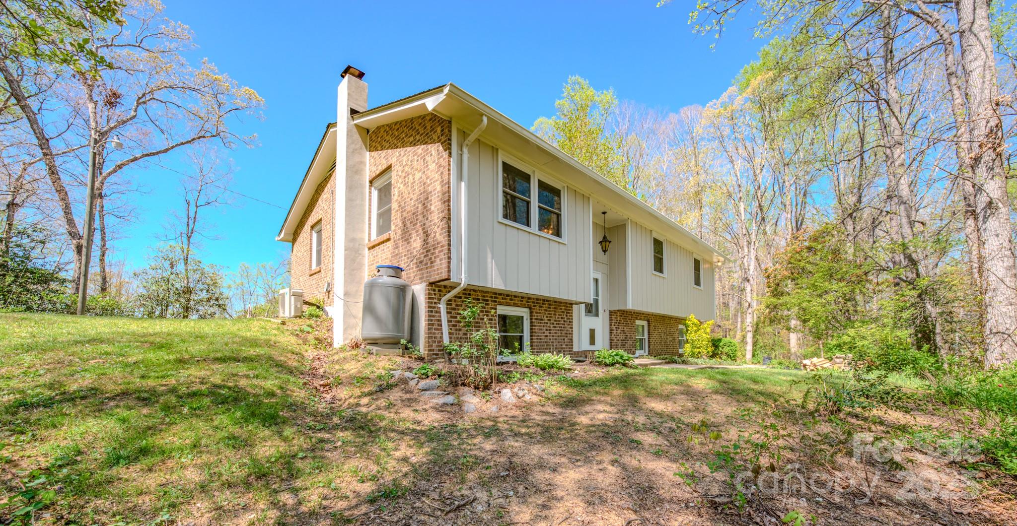 280 Fletcher View Drive Fletcher, NC 28732 - Photo 36 of 40 a view of a house with backyard and trees