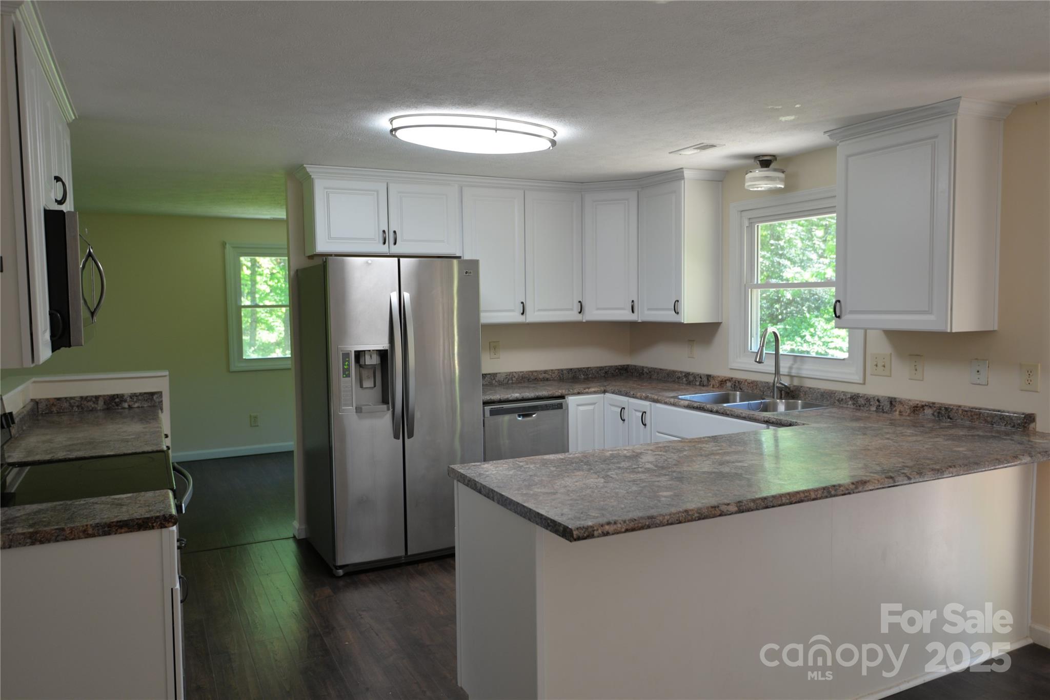 280 Fletcher View Drive Fletcher, NC 28732 - Photo 5 of 40 a kitchen with a refrigerator and a sink