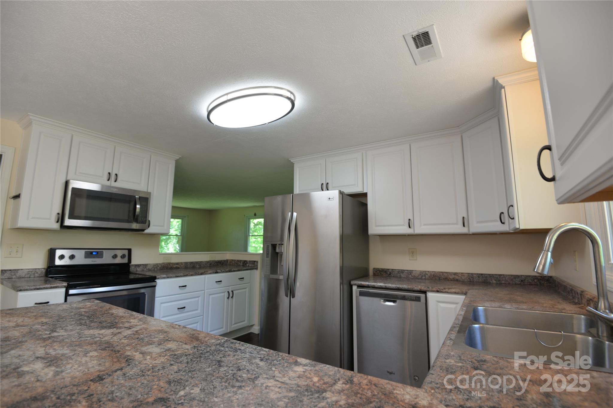 280 Fletcher View Drive Fletcher, NC 28732 - Photo 6 of 40 a kitchen with stainless steel appliances granite countertop a refrigerator a stove top oven a sink and dishwasher
