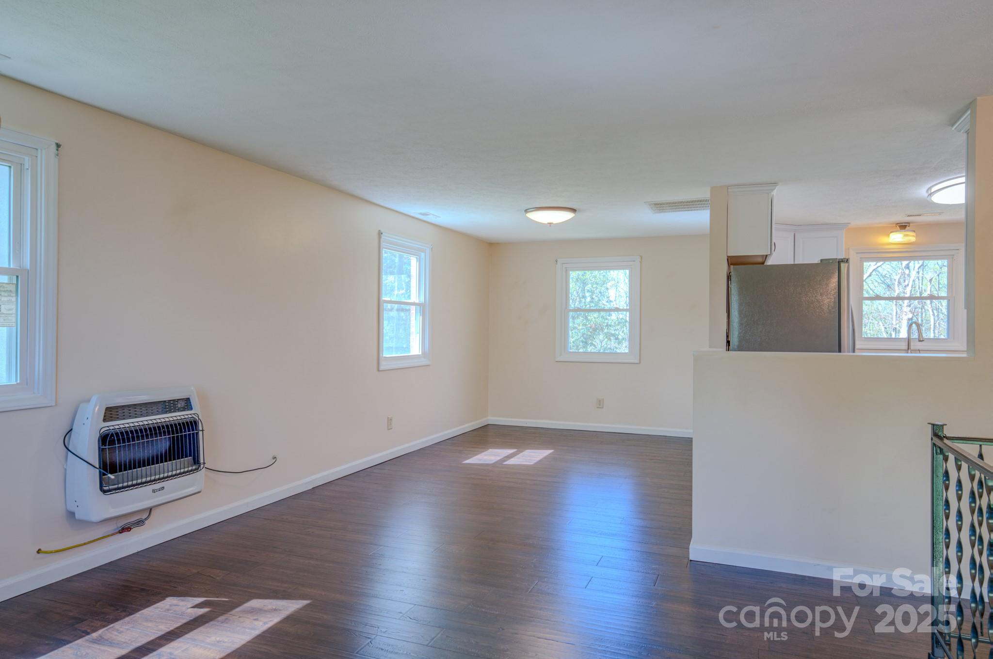 280 Fletcher View Drive Fletcher, NC 28732 - Photo 10 of 40 wooden floor in an empty room with a window