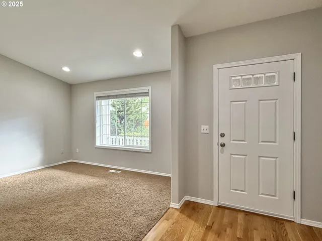 a view of an empty room and window