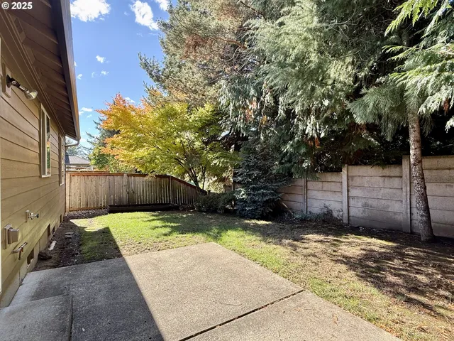 a view of a backyard of the house