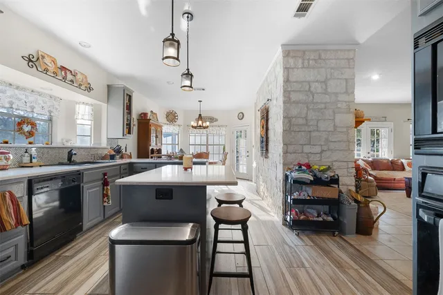 a front view of a house with a yard and a garage